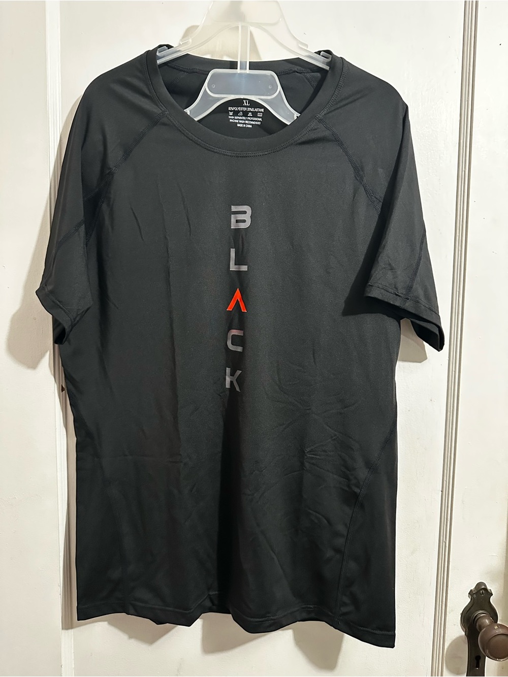 Black Performance Tee with Vertical 'BLACK' Logo -
